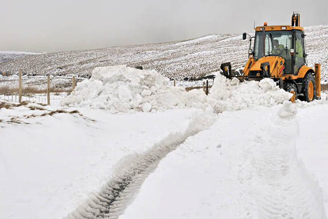 Clearing the snow - Dylife Road summit area
