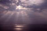 Starburst of crepuscular rays over the sea