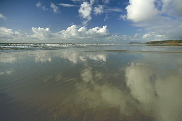refected clouds in wet sand, Borth