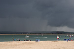 Incoming thunderstorm about to make holidaymakers flee the beach, Aberdyfi